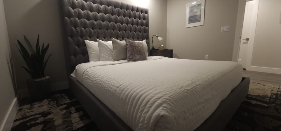 The charming third bedroom provides a king bed and TV.
