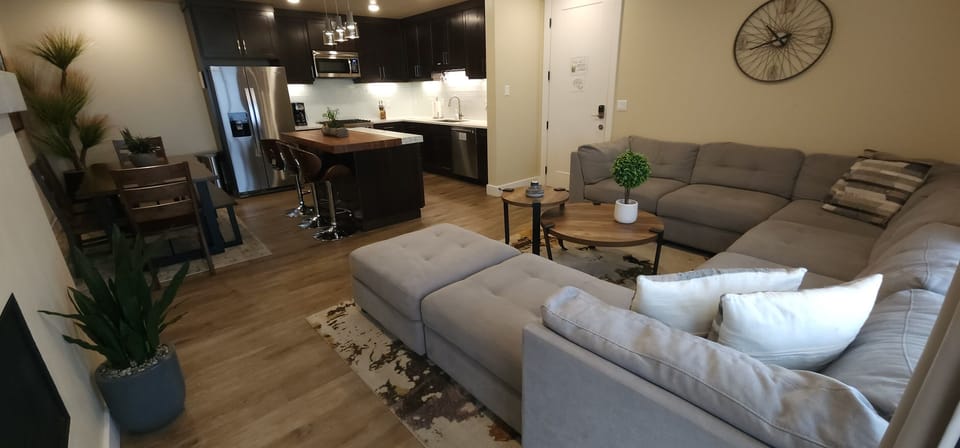 The living area opens seamlessly to the luxury kitchen.
