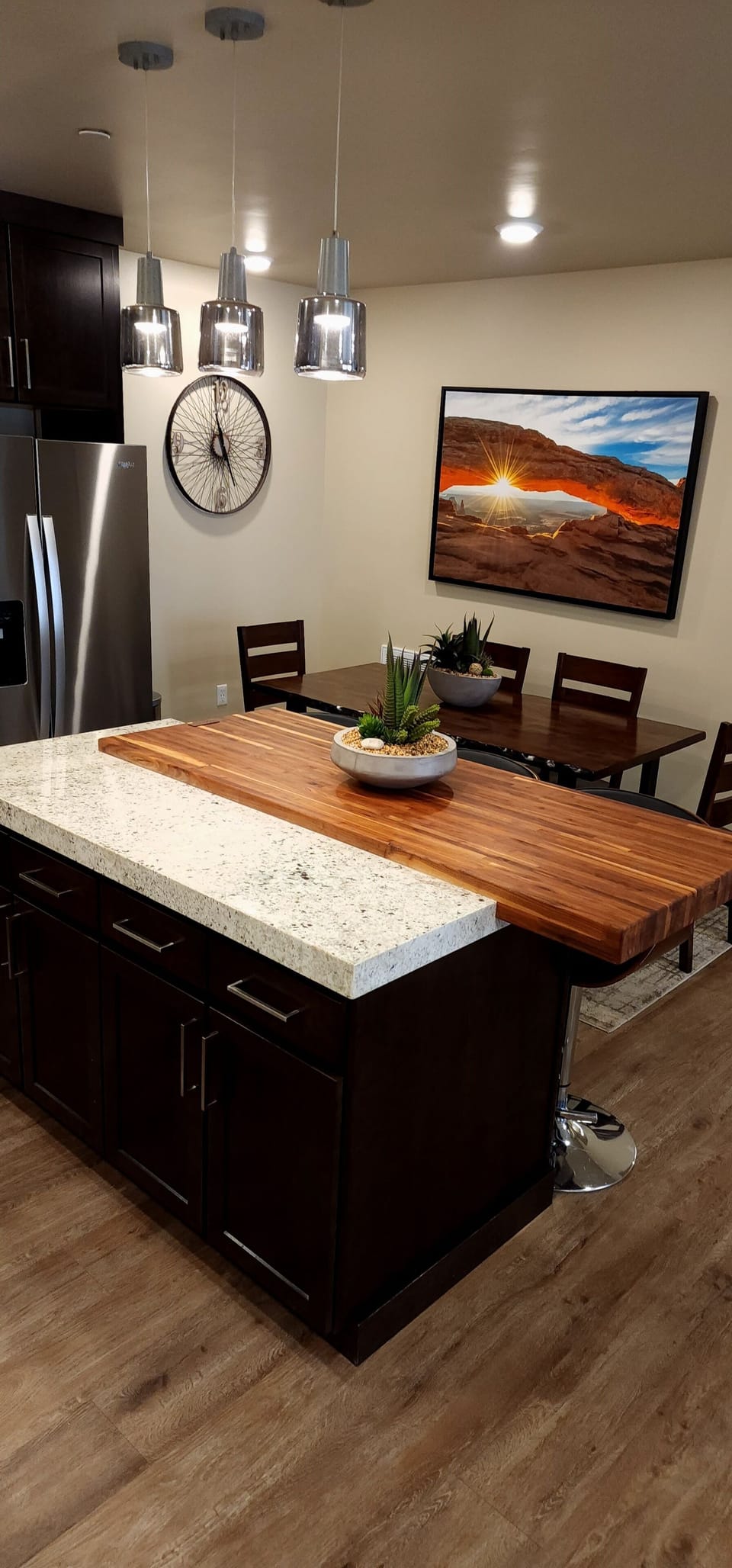 Plenty of seating options available at the dining table or kitchen island.
