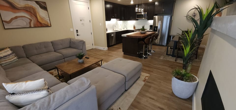 The living area opens seamlessly to the luxury kitchen.