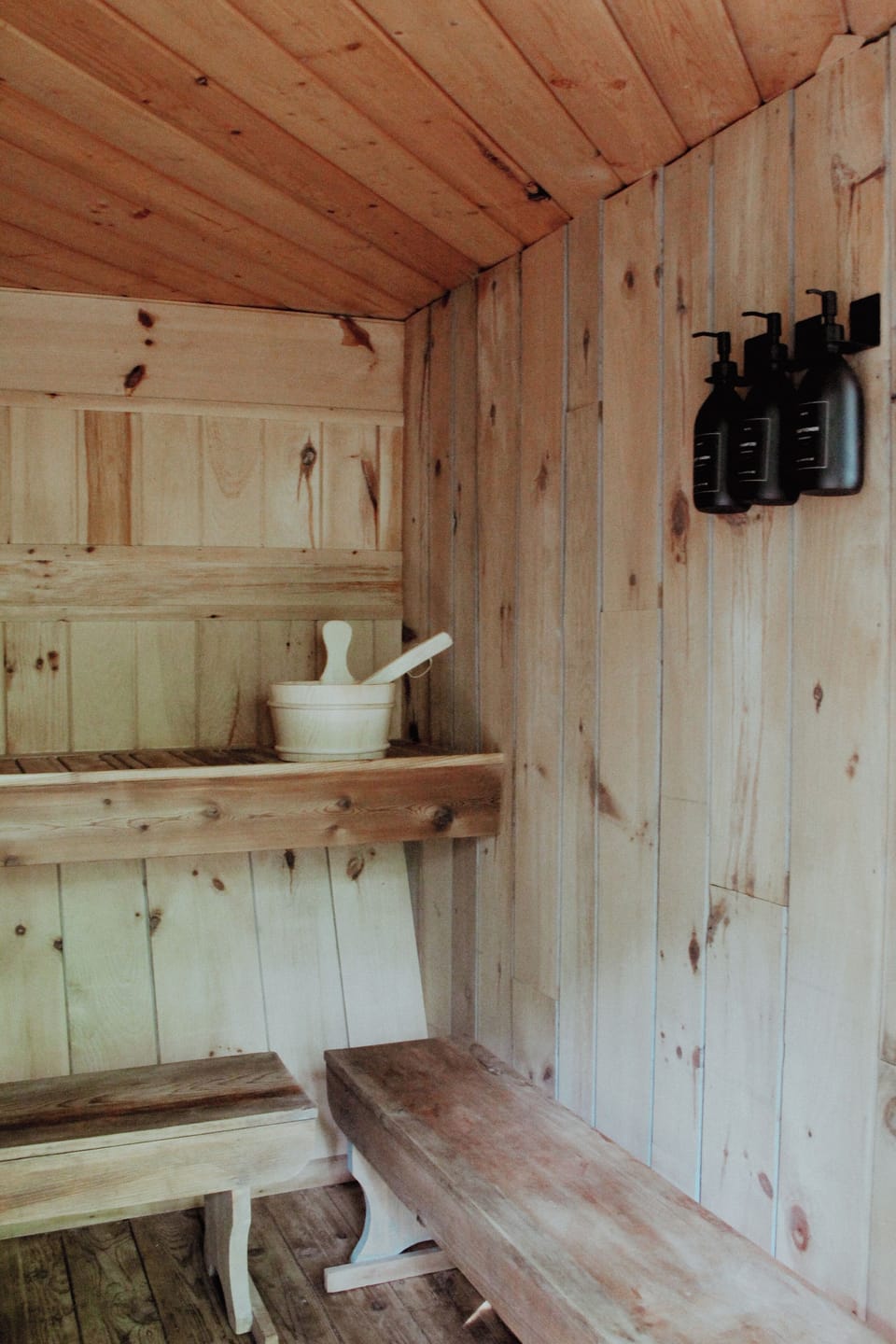 Shampoo, conditioner, body wash and essential oils in sauna.