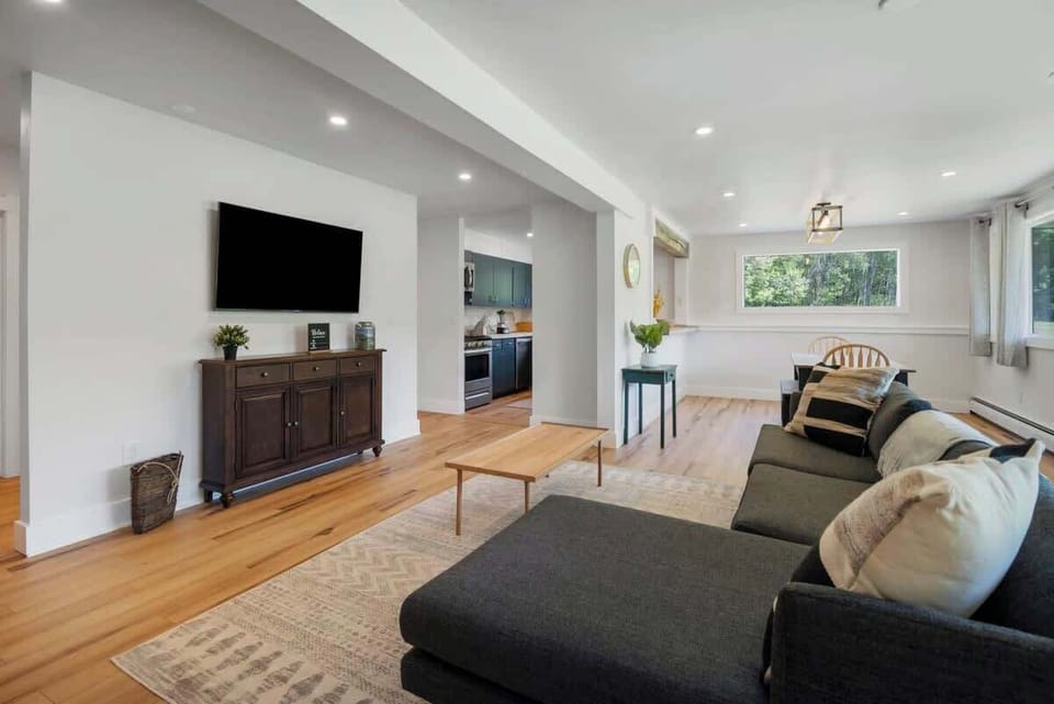 Large couch with a smart TV, the perfect way to wind down after a day outdoors!