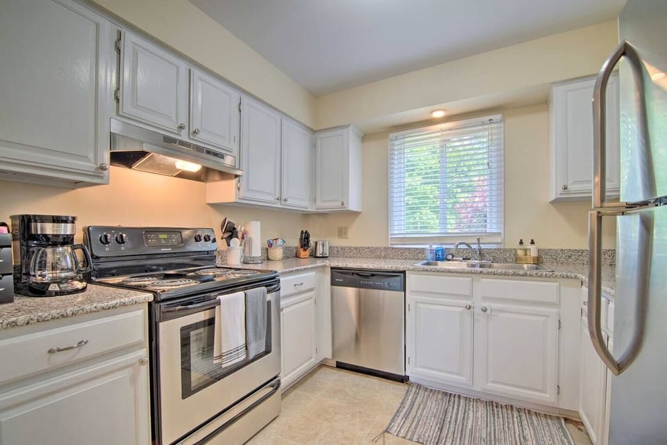 The fully stocked kitchen has granite counter-tops, and stainless-steel appliances including an oven, dishwasher, microwave and a refrigerator with an ice maker. Bakeware, pots and pans, a coffee station, spices and olive oil are provided to ensure y