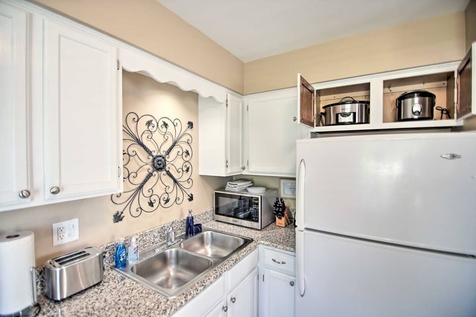 The kitchen is fully stocked with all the modern appliances, dishwasher, refrigerator with ice maker, stainless steel microwave, toaster, slow cooker, rice cooker, air fryer and blender.
