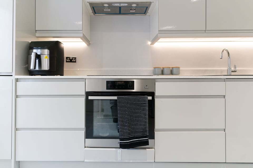 Mini-fridge, oven, stovetop, cookware/dishes/utensils