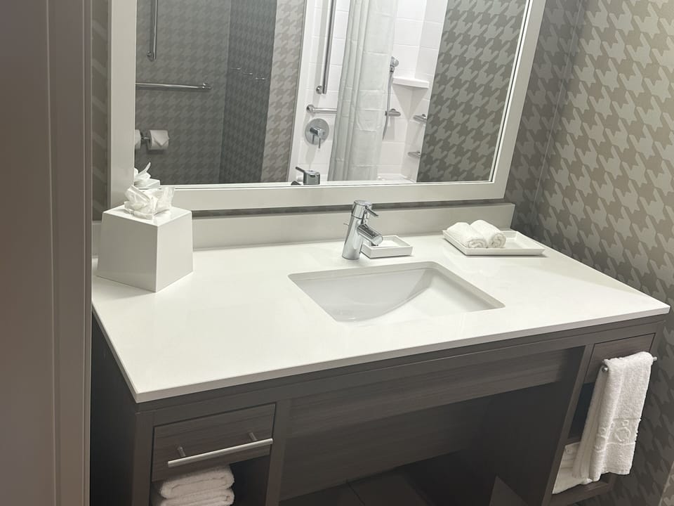 Studio Suite, 1 King Bed | Bathroom | Hair dryer, towels, soap, shampoo