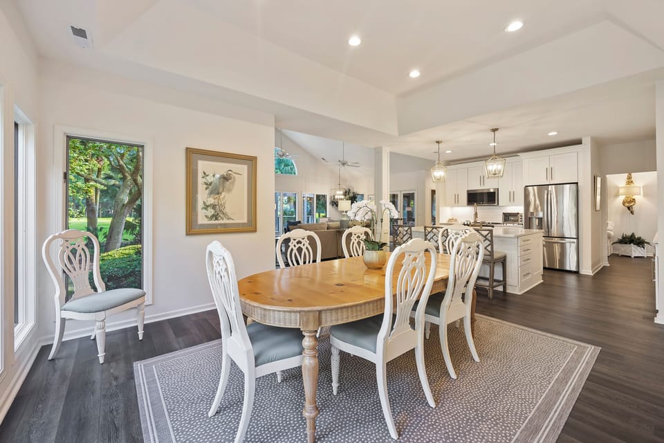 Dining room table seating for 8, plus 3 more at kitchen bar counter.
