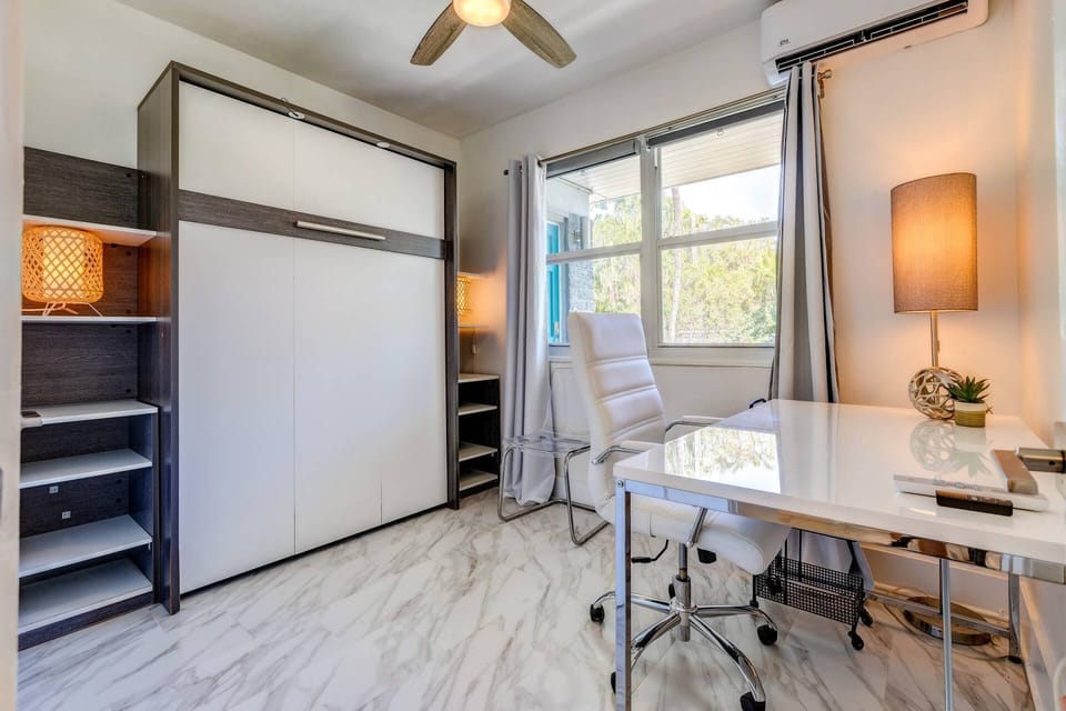 Effortlessly transition from a comfortable workspace to a cozy sleeping area with the Murphy bed closed, maximizing the functionality.