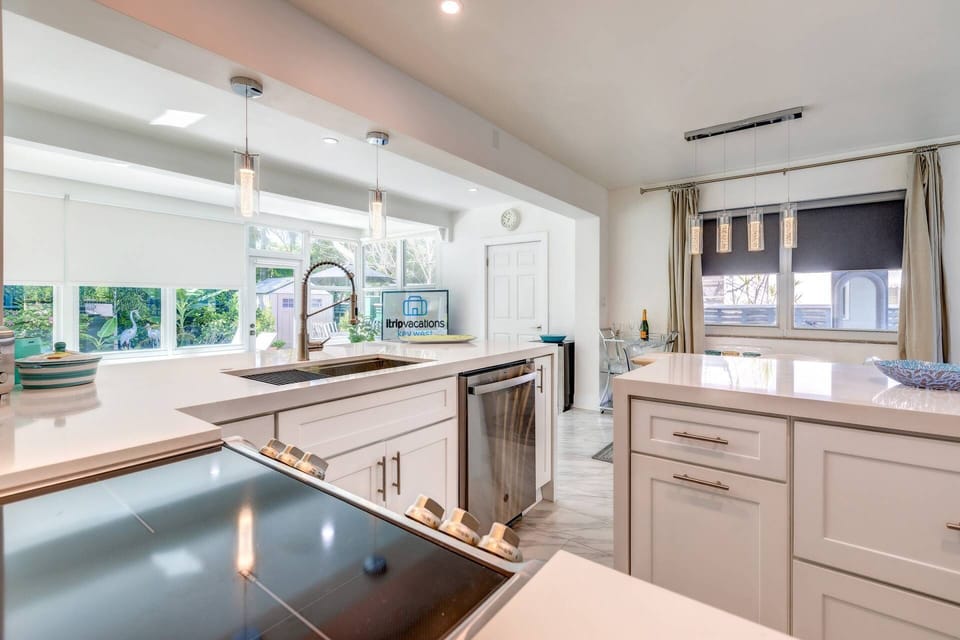 Indulge your culinary creativity in the beautiful kitchen, boasting an abundance of counter space that offers both practicality and elegance.