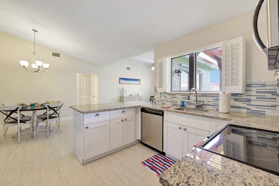 Kitchen Views of Informal Dining and Game Room