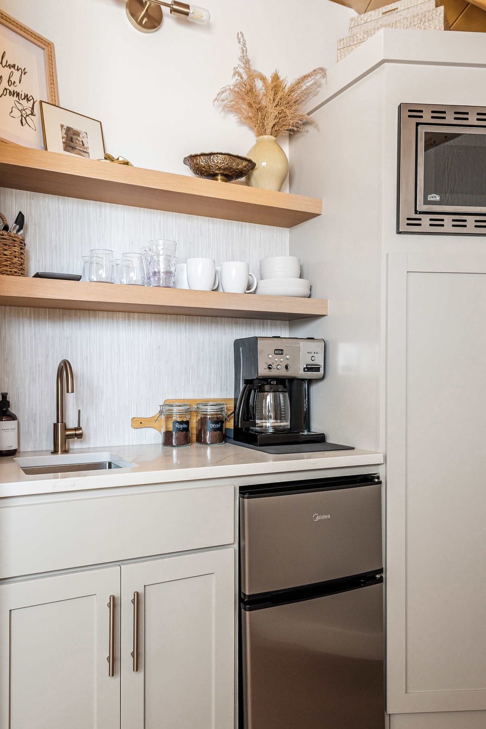 Kitchenette complete with mini fridge, microwave and local coffee grounds