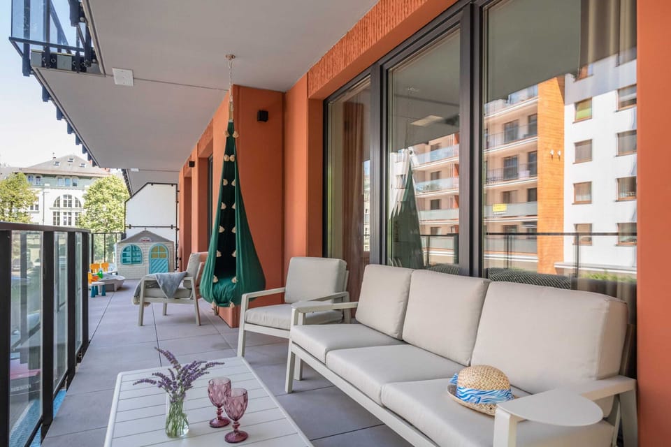 Balcony with comfortable seating, decorative accents, and vibrant views of the surroundings.

