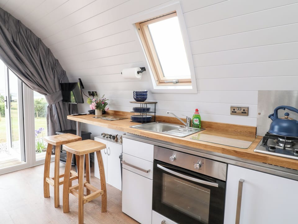 Fridge, electric kettle, cookware/dishes/utensils