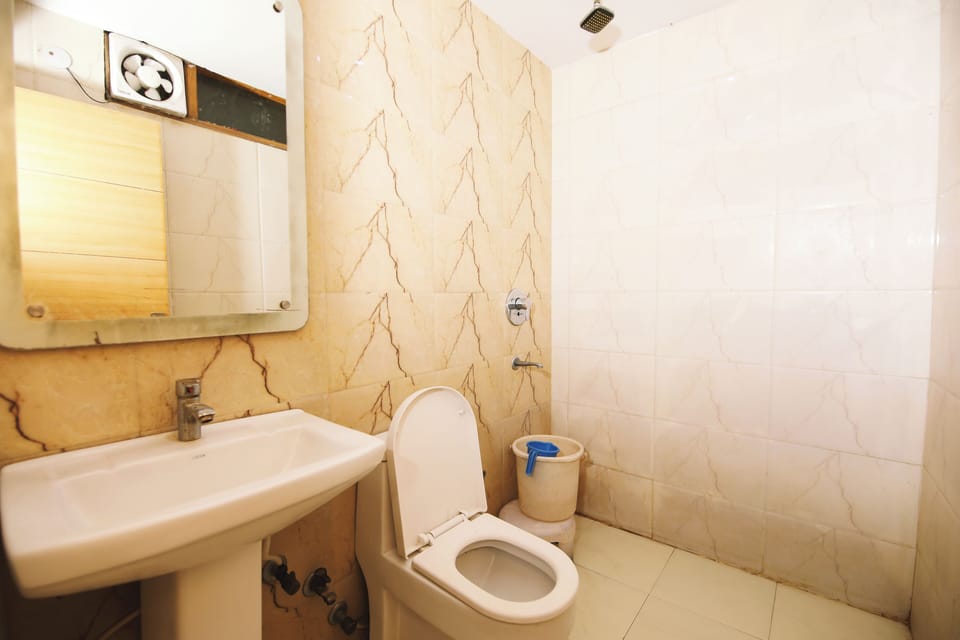 Shower, rainfall showerhead, soap, toilet paper