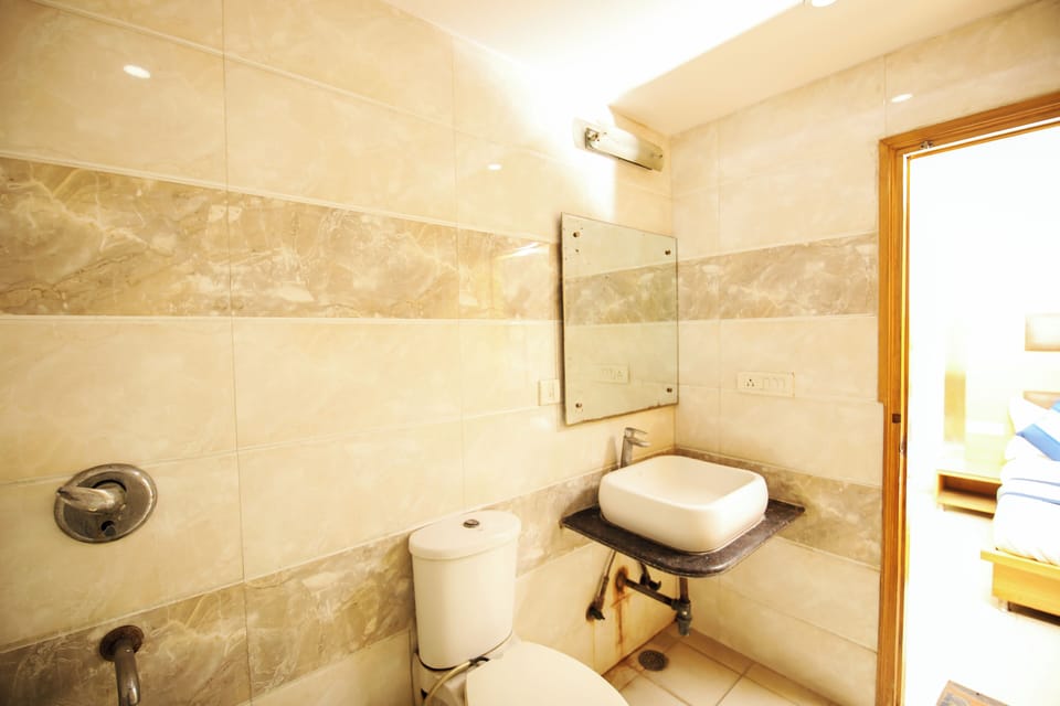 Shower, rainfall showerhead, soap, toilet paper