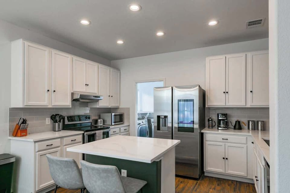 Everything you need to cook delicious meals in your large chefs kitchen with smart fridge. 