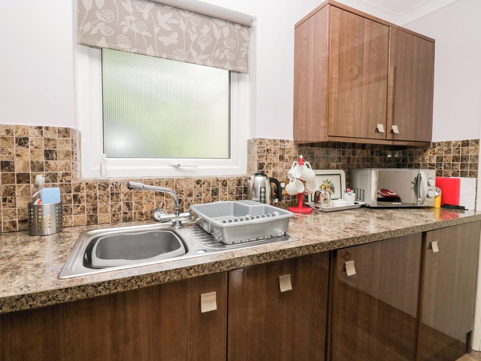 Fridge, electric kettle, toaster, cookware/dishes/utensils