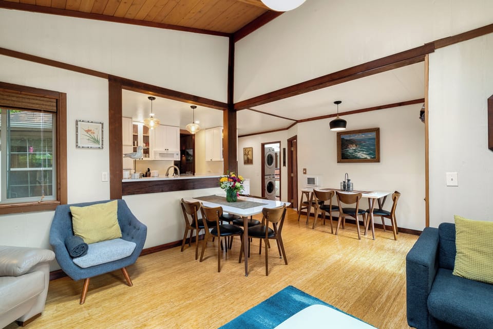 Cozy living room with beautiful views out to the garden area.Open to the dining area.