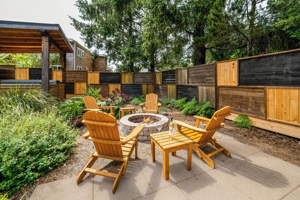 Fenced back yard garden with firepit, hot tub, sauna, covered outdoor dining area