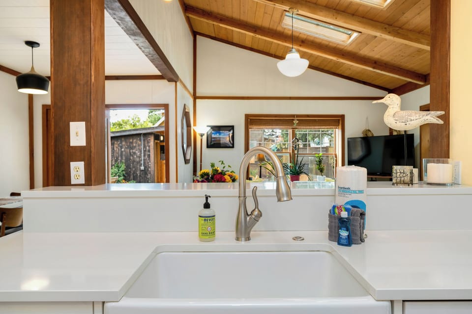 Fully equipped kitchen with side yard access to Gas BBQ. Open to the living area.