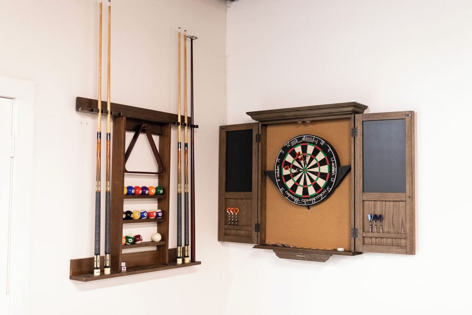 Arcade/Media room with media room, professional pool and ping pong tables, poker table, darts and arcade games.