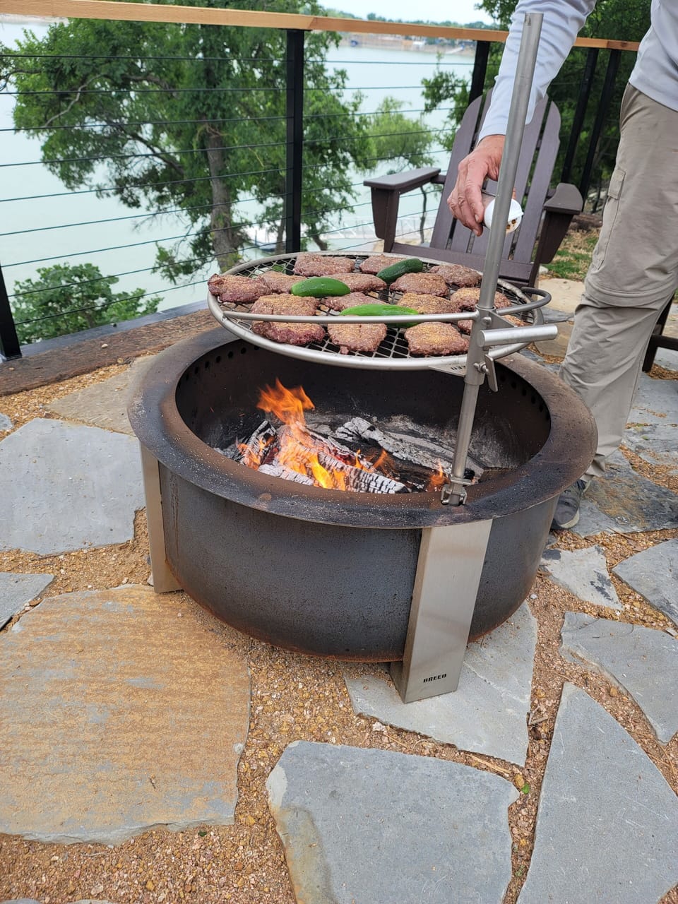 Fired up and ready to feast! This is lakeside living at its best—where crackling flames, stunning views, and unforgettable nights come together.