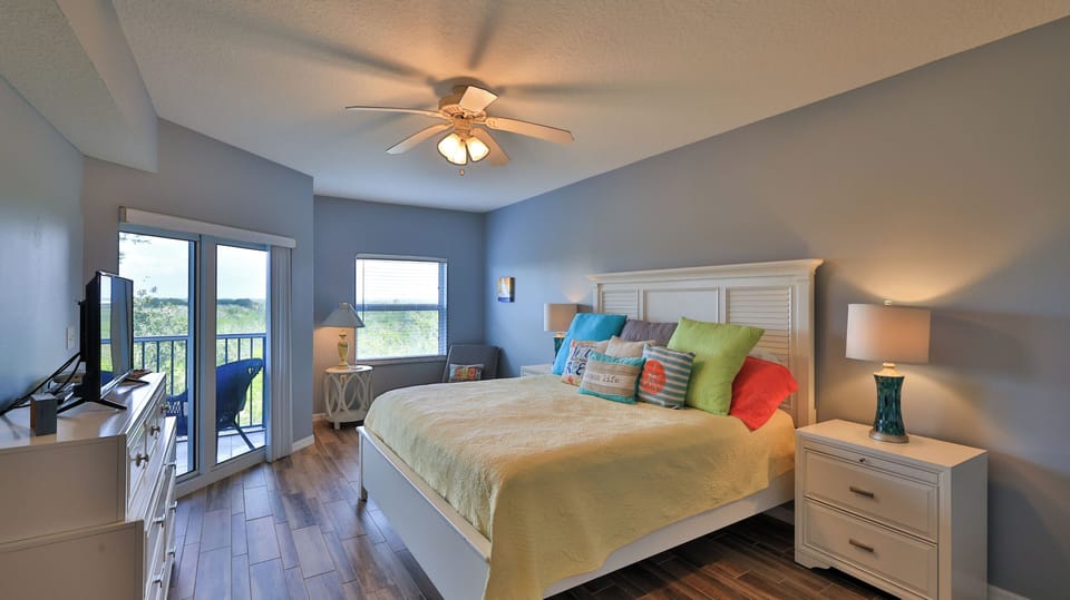 After a day in the sun, relax in the master suite with balcony access!