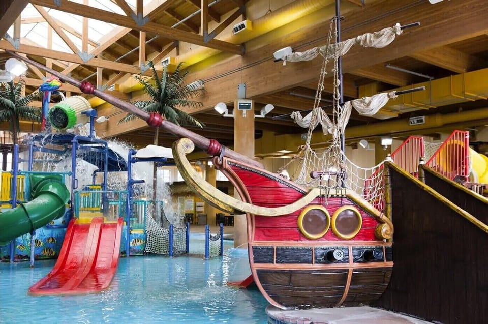 The indoor waterpark has a lazy river, hot tub, and two slides.
