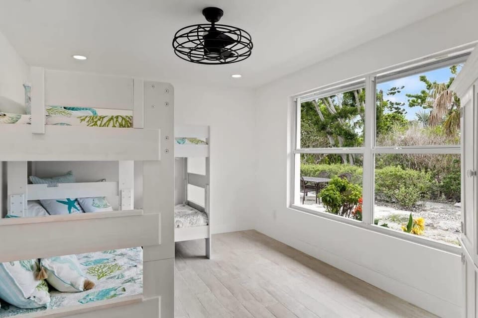 Guest bedroom two with dual bunk beds and trundle bed,  perfect for kids!