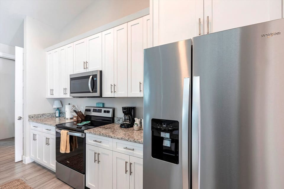 Kitchen Delight: Whip up culinary masterpieces in this stylish, modern kitchen with sleek appliances!
