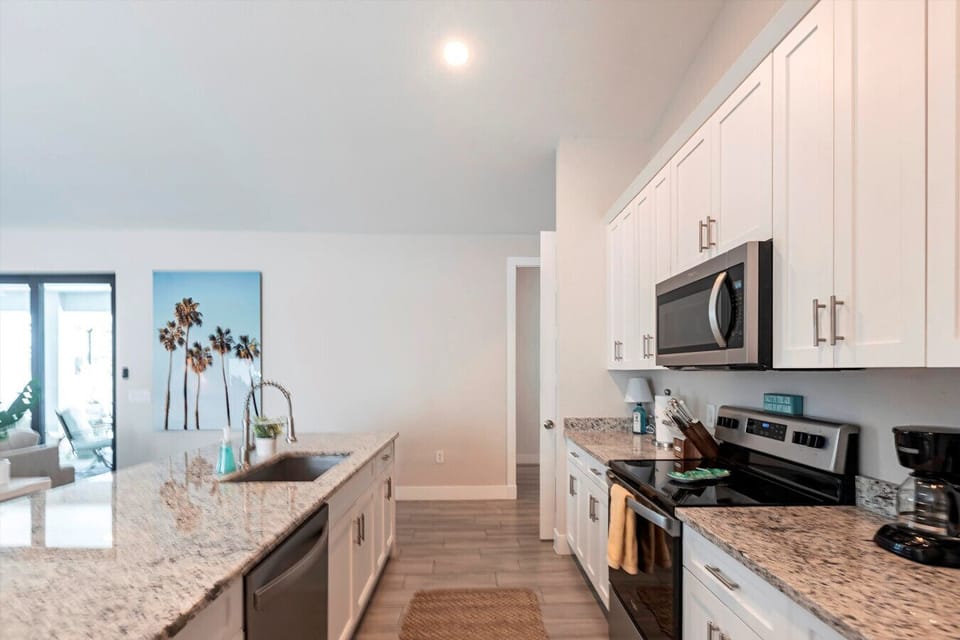 Kitchen Paradise: Modern granite countertops and sunny vibes invite culinary adventures!