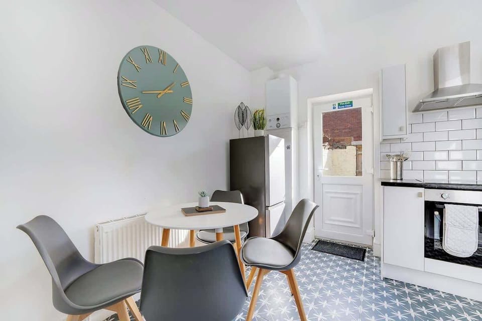 Spacious 4-seater dining table perfect for group meals and gatherings