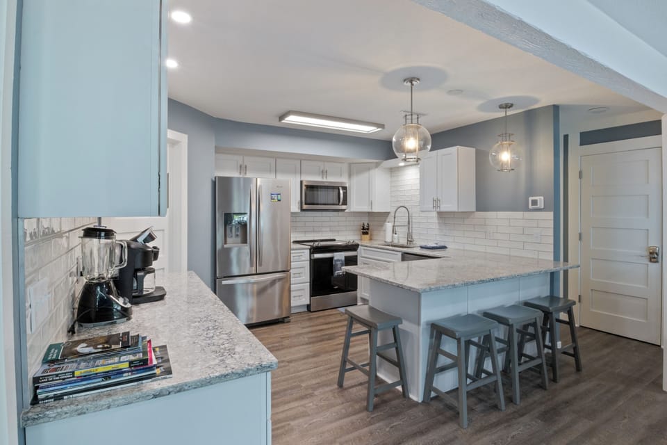 Clean and spacious kitchen with an inviting coffee bar.