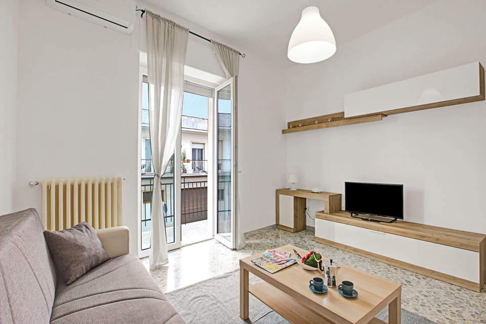 Family Apartment, 2 Bedrooms, Balcony (Casa Ojala' in the center of) | Living area | Flat-screen TV