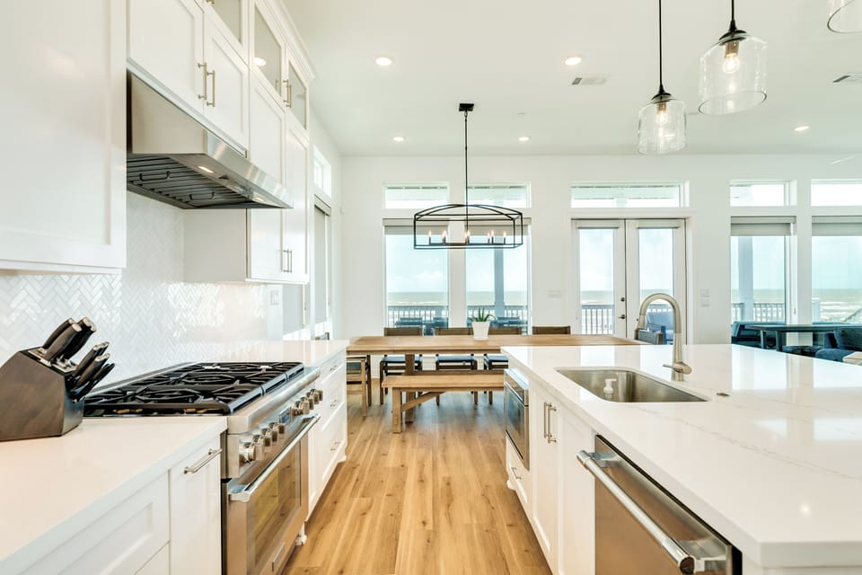 Chef's kitchen with gas stove and stainless steel appliances
