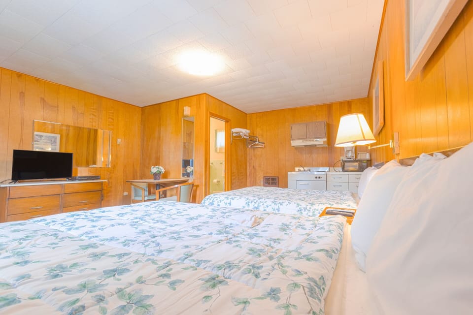 Family Room, 2 Queen Beds, Kitchenette | Desk, iron/ironing board, free WiFi, bed sheets