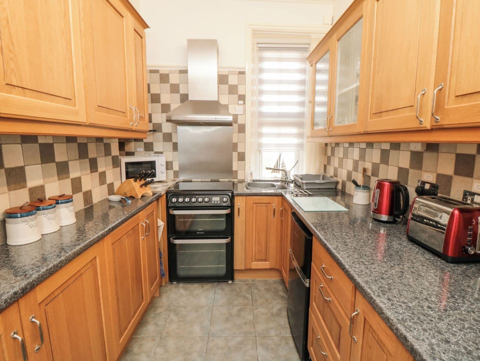 Fridge, electric kettle, toaster, cookware/dishes/utensils