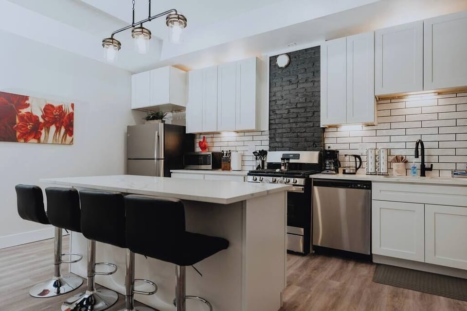 Full kitchen — island seating, stainless appliances, and everything to cook with
