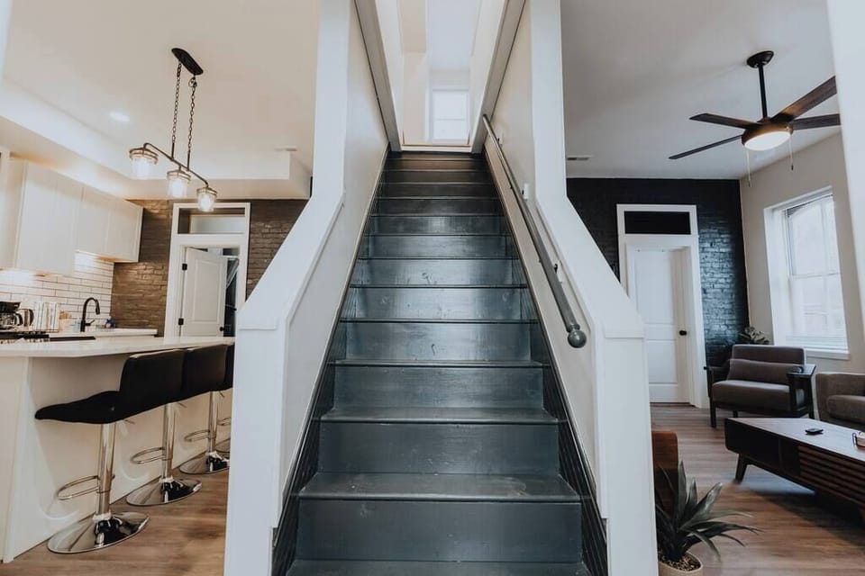 Interior staircase — private entry to the top-floor apartment