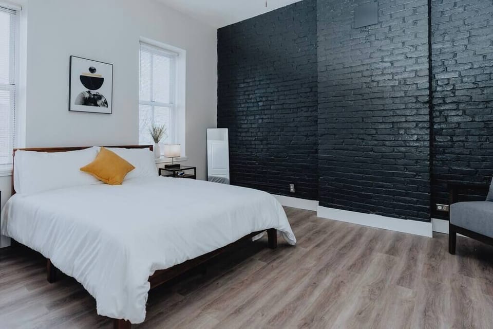 Bedroom — exposed brick and fresh linens