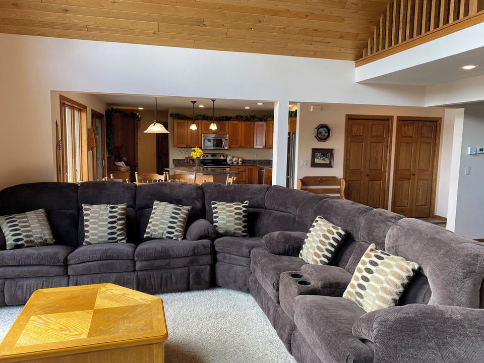Comfortable furniture with 4 recliners in sofa and 2 reclining chairs.