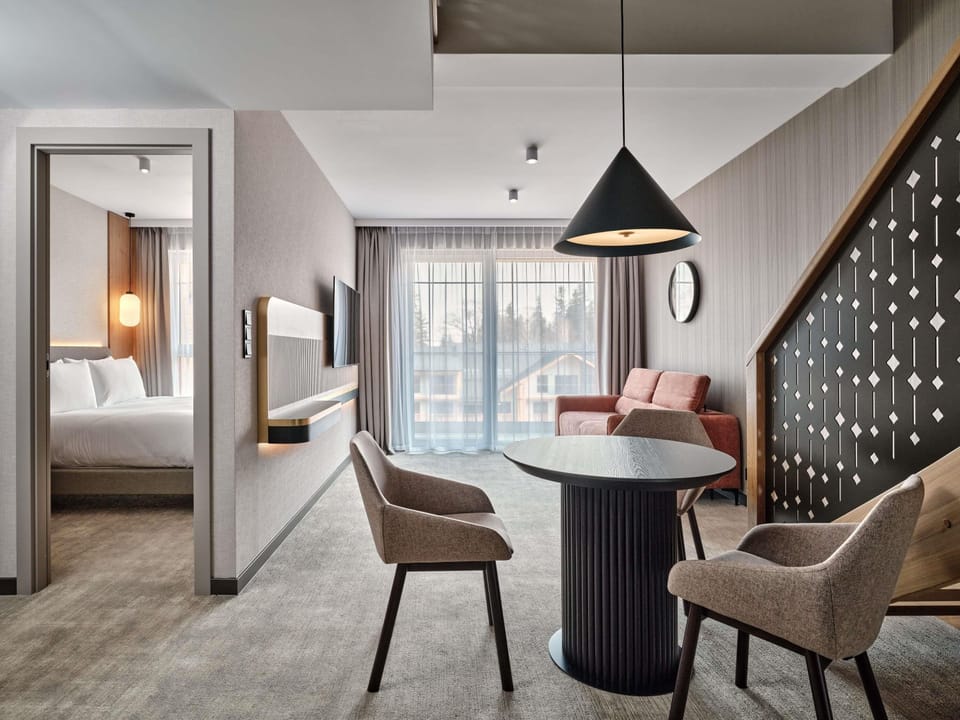 Deluxe Room, Multiple Beds | Minibar, in-room safe, desk, laptop workspace