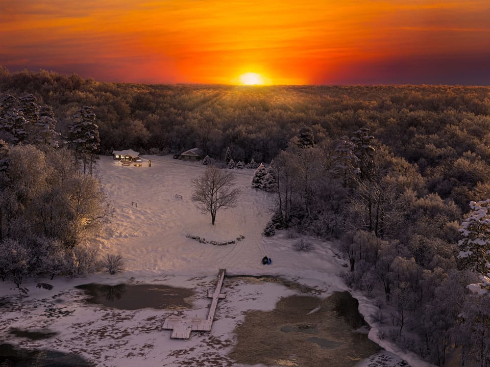 Ariel view of the property during sunset in winter