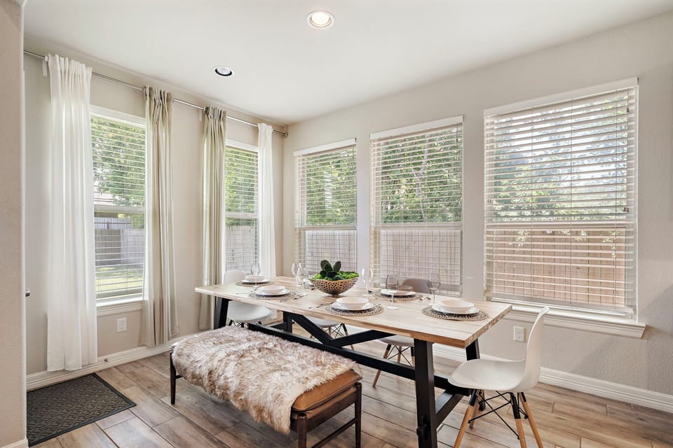 Spacious dining table that sits 6 with full tableware and silverware included.