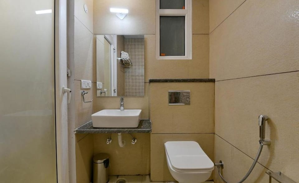 Shower, rainfall showerhead, towels, soap