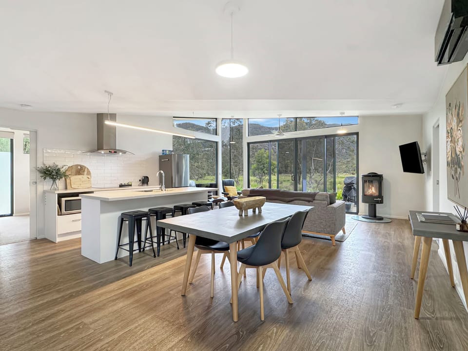 Discover the heart of our home in the well-equipped kitchen and dining area.
