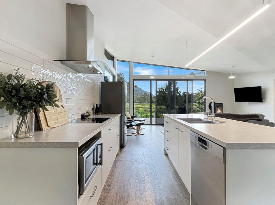 Enjoy our kitchen's modern amenities and dishwasher for easy meal prep and clean-up.