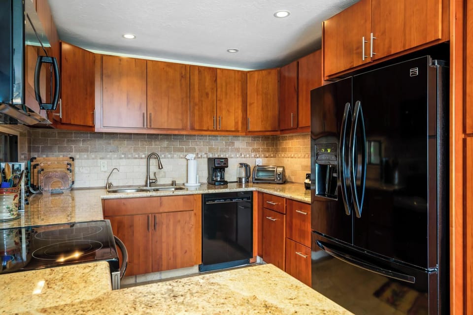 Kitchen is equipped with all the appliances you could need