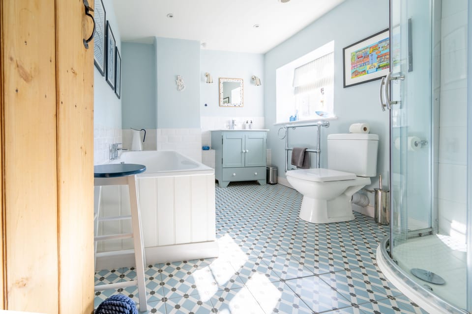 First floor: Bathroom with bath, separate shower, wash basin, WC and heated towel rail