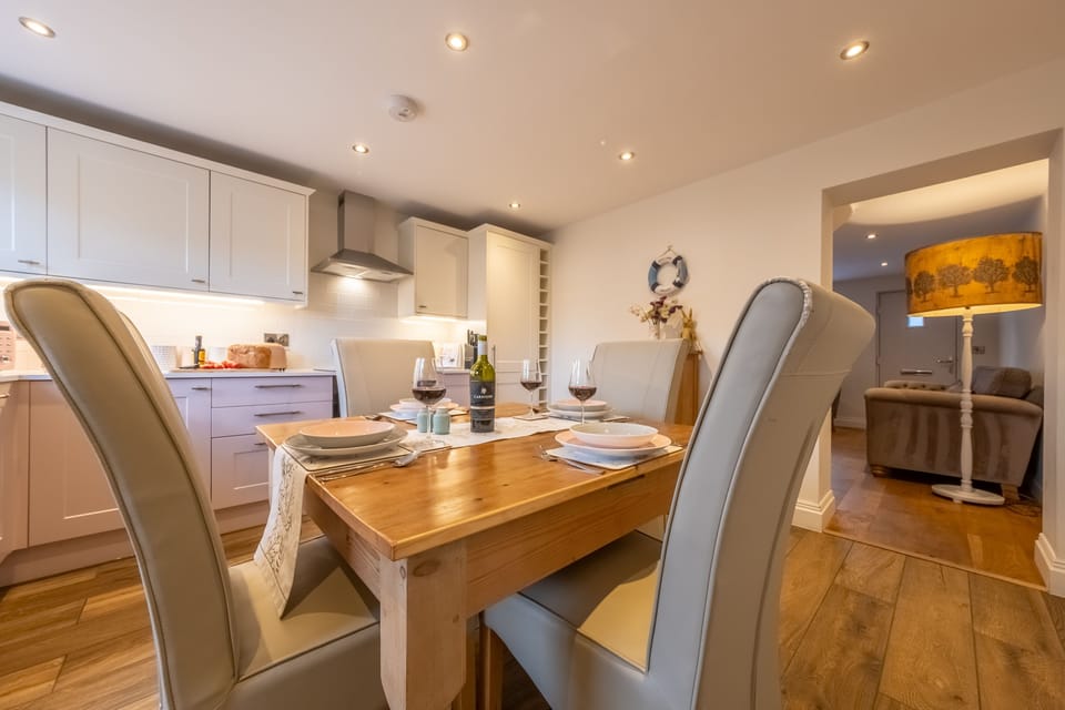 Ground floor: Dining area with kitchen beyond